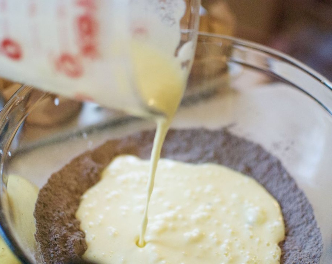 step 3 In a 2-cup measure whisk together Buttermilk (2/3 cup), Sour Cream (1/2 cup), Farmhouse Eggs® Large Brown Eggs (2), and Butter (3 Tbsp). Add all at once to the flour mixture. Gently stir just until moistened, batter should be lumpy.