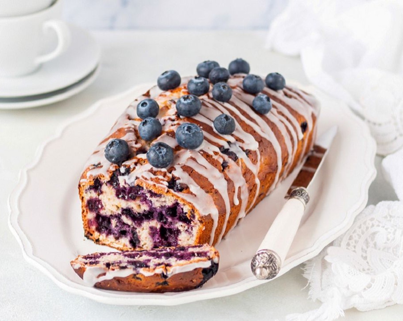 step 7 Mix the Powdered Confectioners Sugar (1/2 cup) with the almond Almond Extract (1/2 tsp) and Milk (3 Tbsp) in a small bowl. Pour this over the warm cake then serve with fresh blueberries. Enjoy!