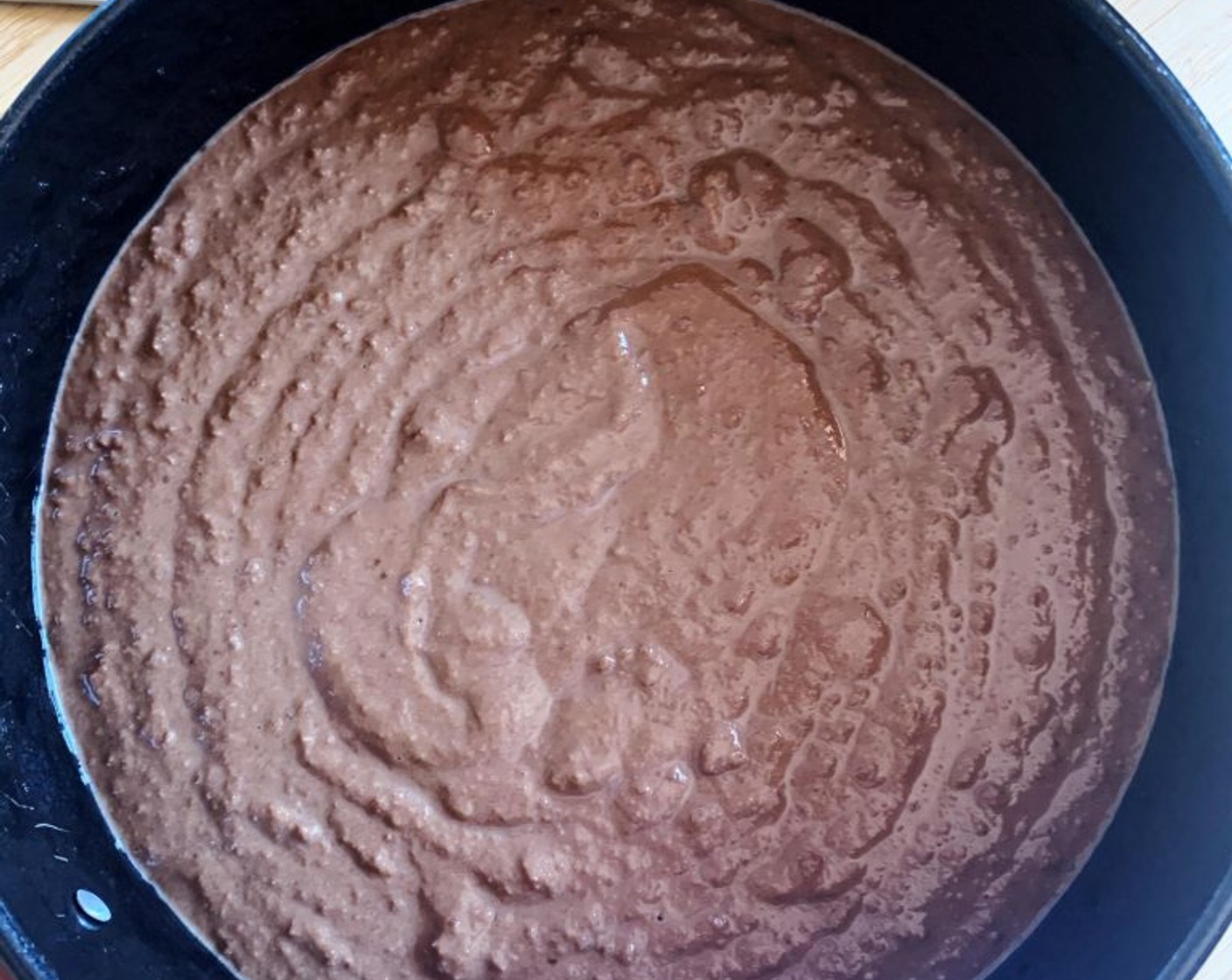 step 4 Transfer batter into an 8-inch cake pan, lined with parchment paper.