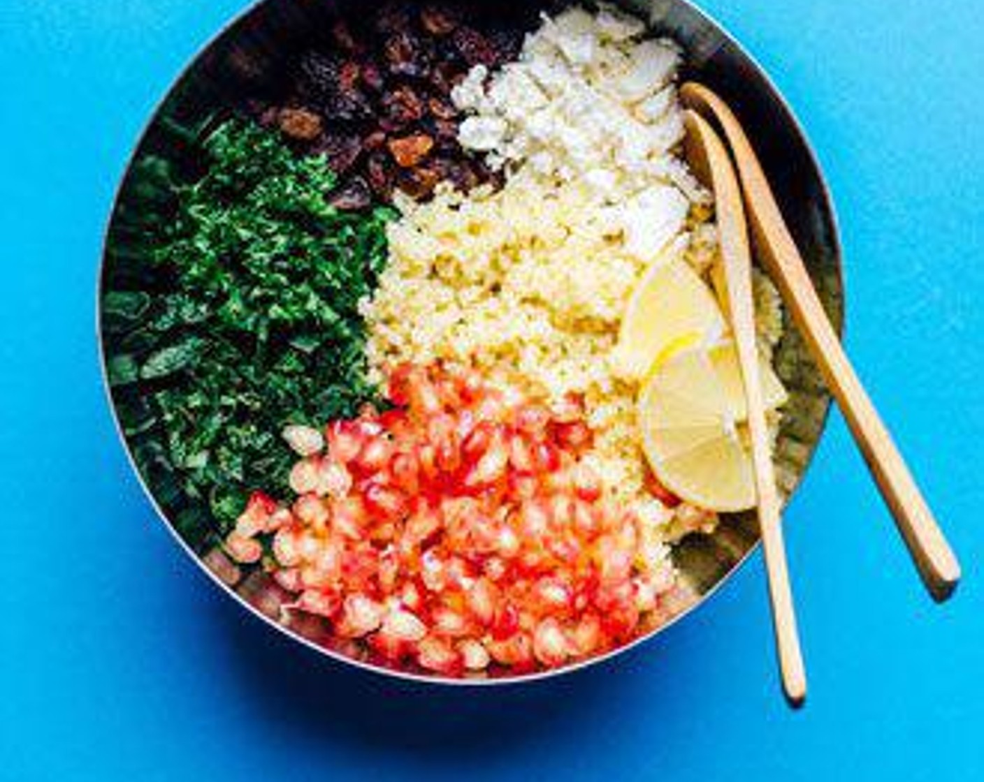 step 2 In a large bowl, toss together cooked wheat, Pomegranate Seeds (1/2 cup), Fresh Mint (1/4 cup), Fresh Parsley (1/4 cup), Feta Cheese (1/4 cup), Raisins (1/4 cup), Extra-Virgin Olive Oil (2 Tbsp), Lemon (1/2), Salt (1/2 tsp), and Ground Black Pepper (1/2 tsp).