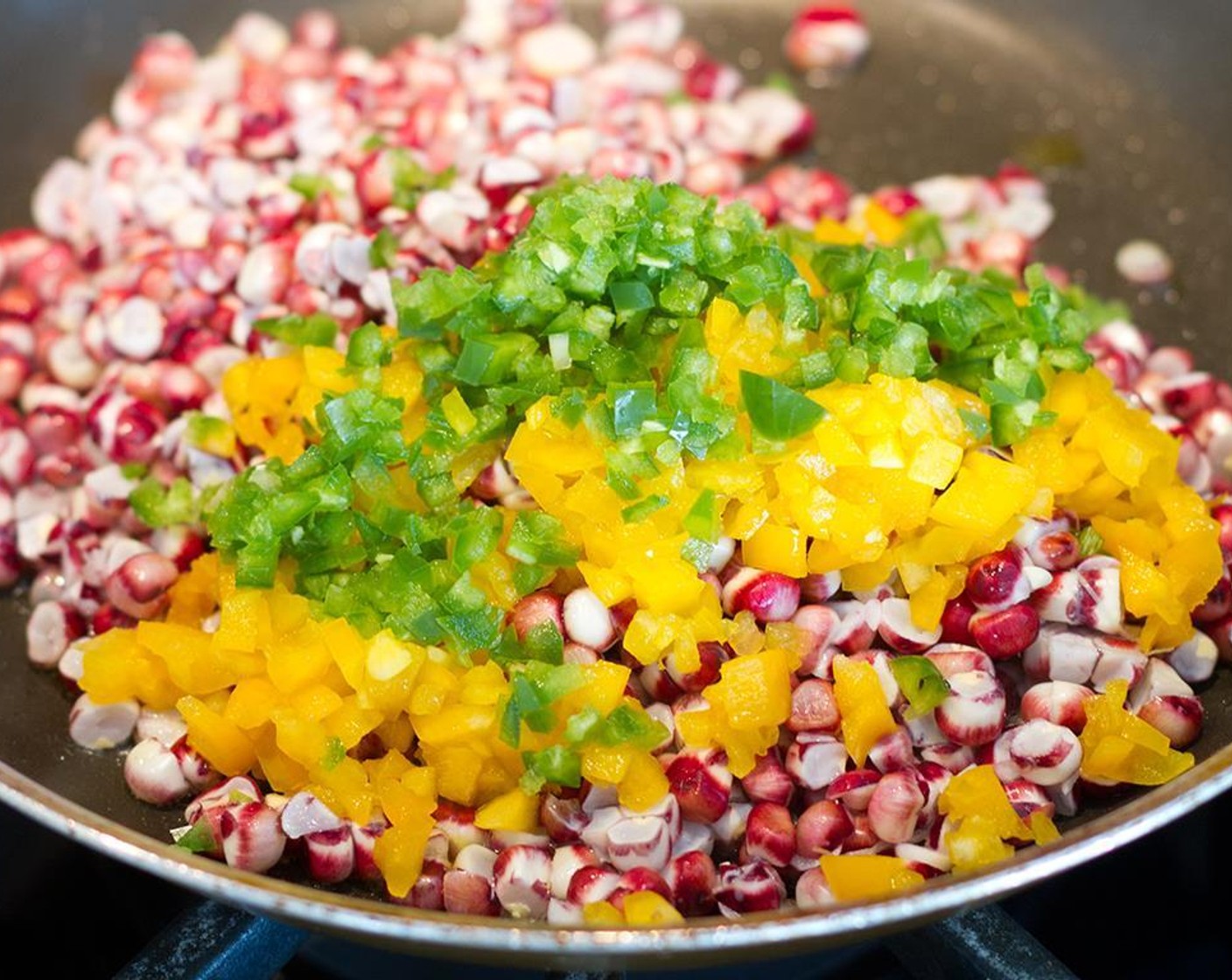 step 7 Once melted, add yellow bell pepper (1/4 cup), jalapeno pepper (1) and yellow corn kernels (2 cups) stirring occasionally, and cook for 10 minutes. Remove the skillet from the heat, mix in the scallion (3), and set aside to cool down.