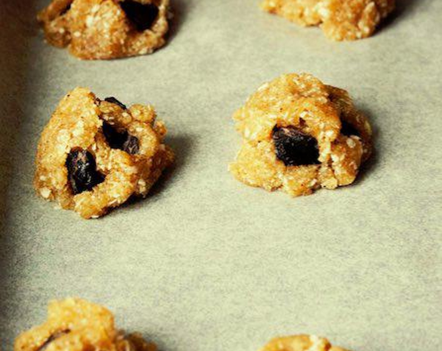 step 5 Slightly press 2 or 3 Dark Chocolate Chips (to taste) into the top of each cookie.