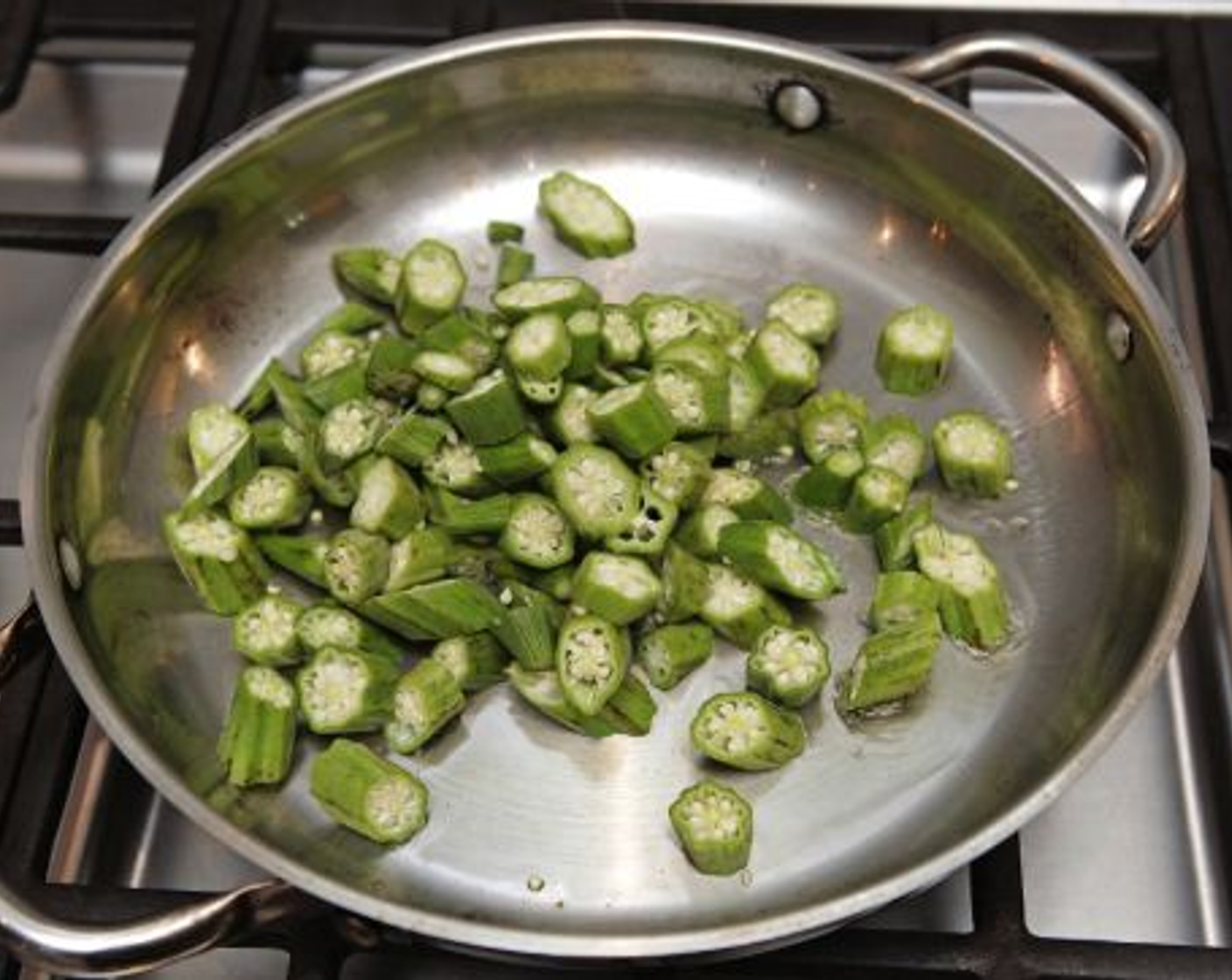 step 7 While the squash is roasting, heat a large sauté pan over medium high heat. Add 2 tablespoons Olive Oil (to taste). Add the okra; cook while stirring 4-6 minutes. Add onions; cook, stirring occasionally 2-3 minutes, or until onions are translucent. Season to taste with some of the remaining Seasoned Salt (to taste), then remove from heat.