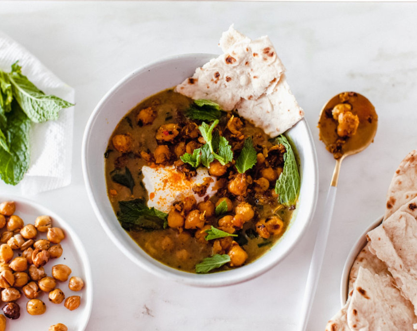 step 7 Divide among bowls and top with Fresh Mint Leaves (1 cup), reserved chickpeas, a sprinkle of red pepper flakes, and a good drizzle of olive oil. Serve alongside Yogurt (to taste) and Lavash (to taste) if using; dust the yogurt with turmeric if you'd like.