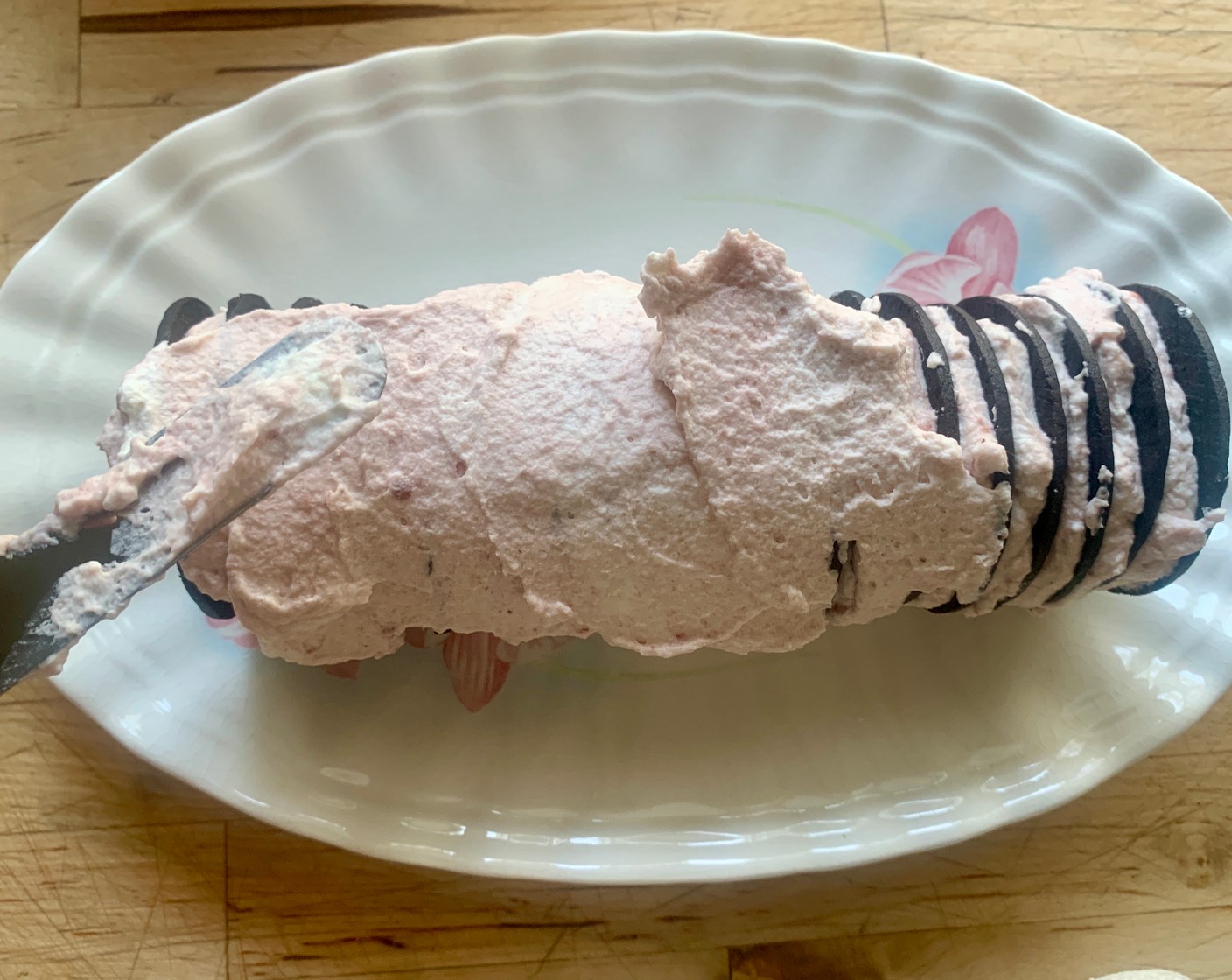 step 6 When you’ve run out of wafers, frost with the remaining whipped cream raspberry mixture.