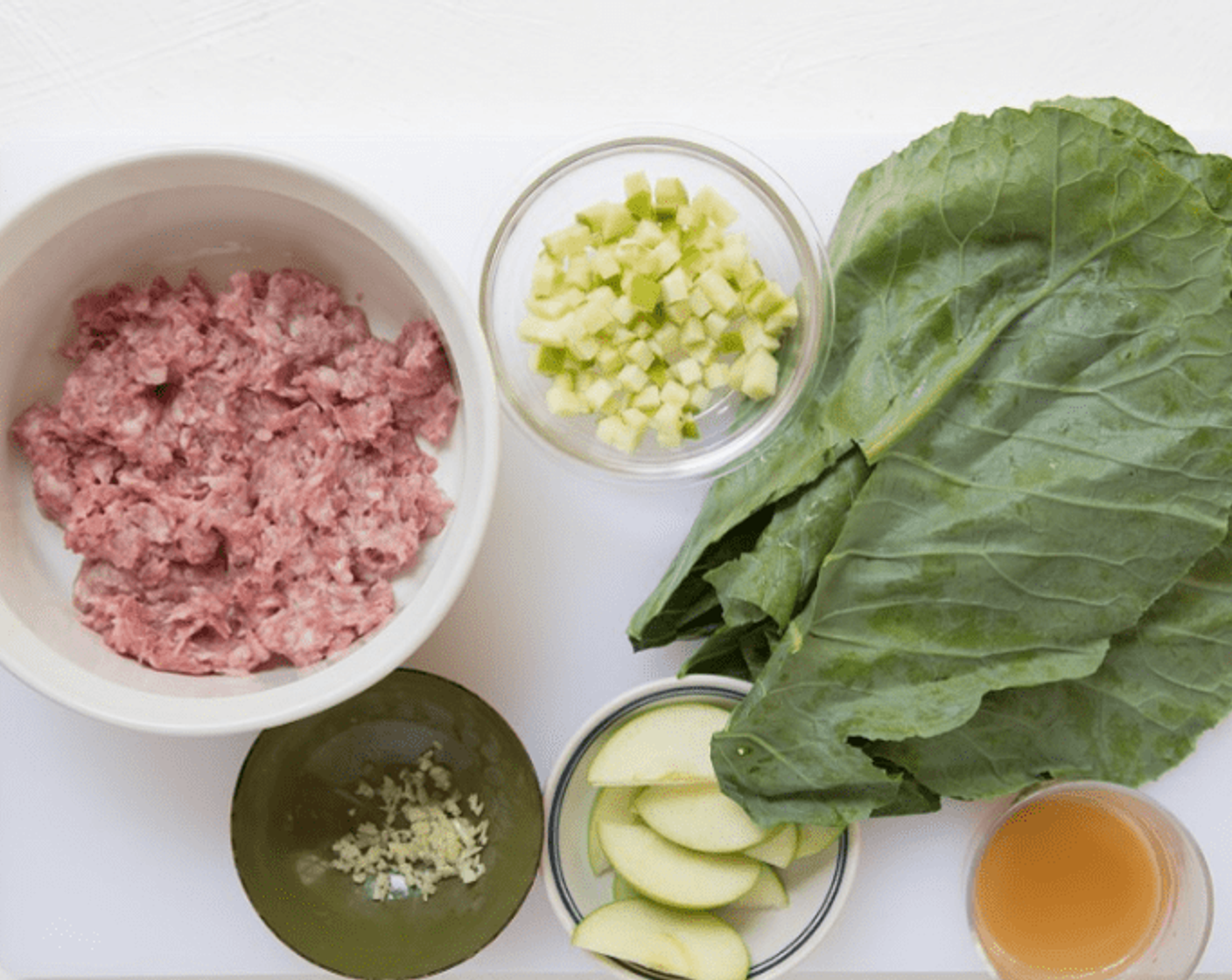 step 3 While rice is cooking, prepare your mise en place for stuffed collards: Wash Collard Greens (to taste) well to remove any sand or debris. Cut out the heaviest part of the stems, leaving the whole leaves intact. Finely chop the stems.