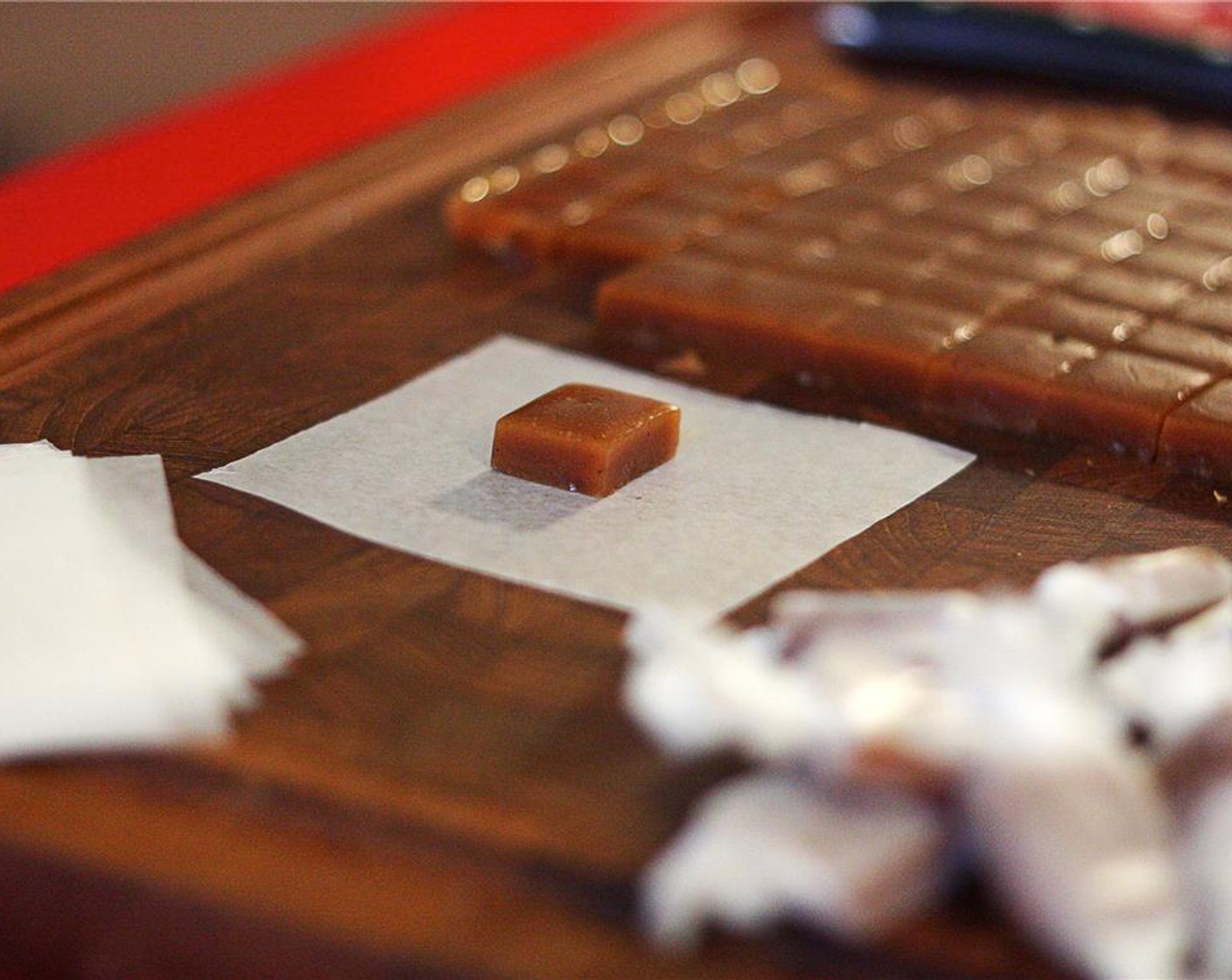 step 9 Wrap each caramel in a four-inch square of waxed paper.