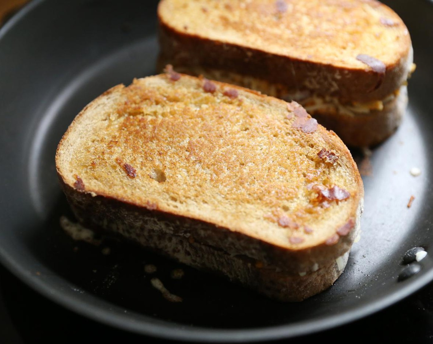 step 11 Pan-fry the sandwiches on either side, until outside is toasted and the cheese mixture has melted.