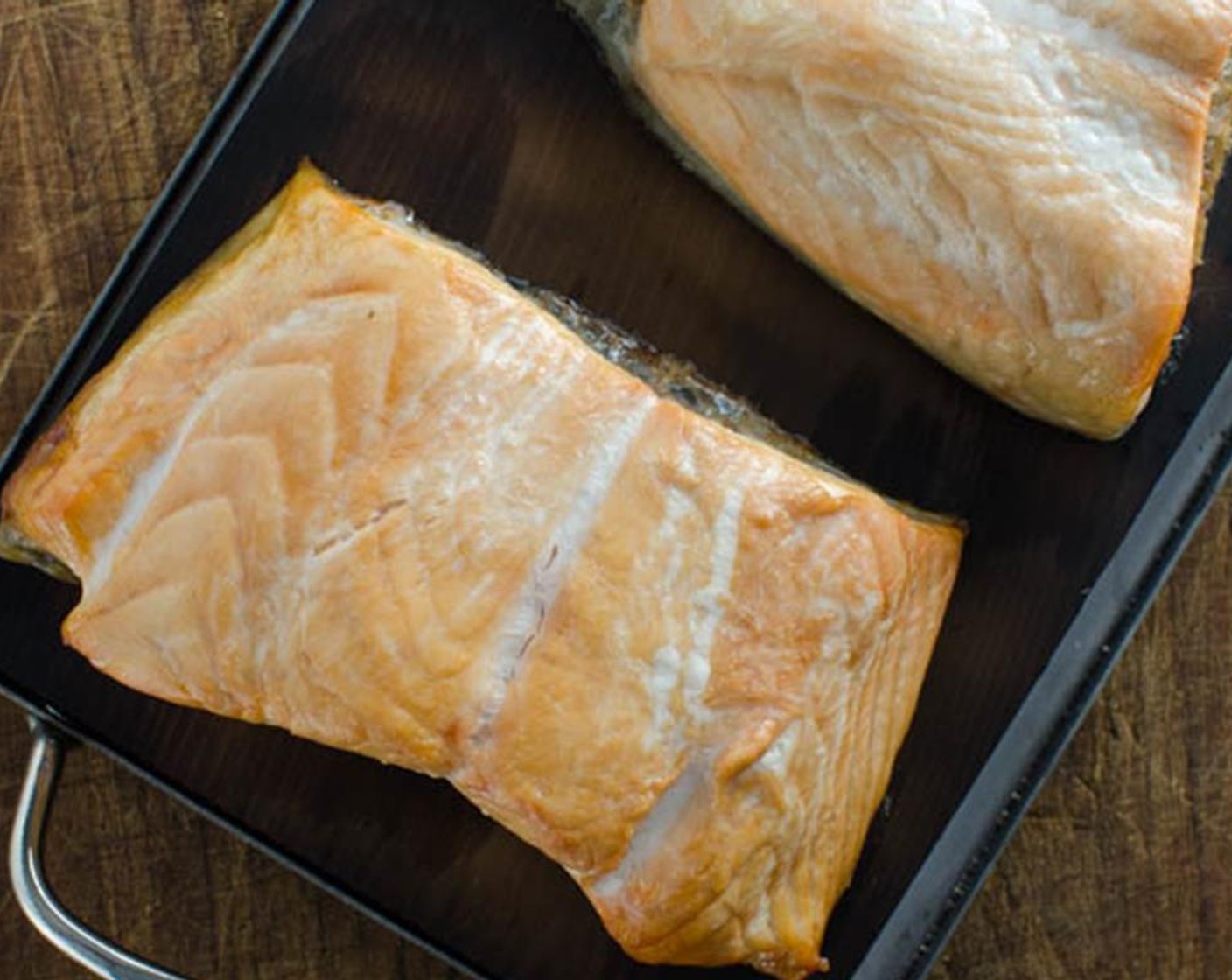 step 6 Carefully remove plank and fish from the grill and rest on a cutting board or baking sheet for about 5 minutes.