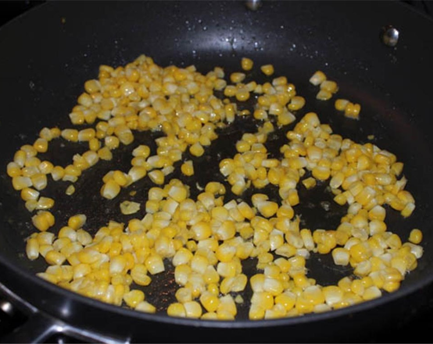step 5 Heat one tablespoon of olive oil in a large pan. When hot, add the corn kernels and sauté for about 3 minutes until just tender.