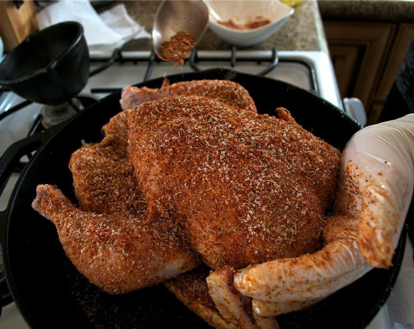 step 5 Rub the entire chicken with Olive Oil (1 splash) and sprinkle liberally with the spice rub mixture.