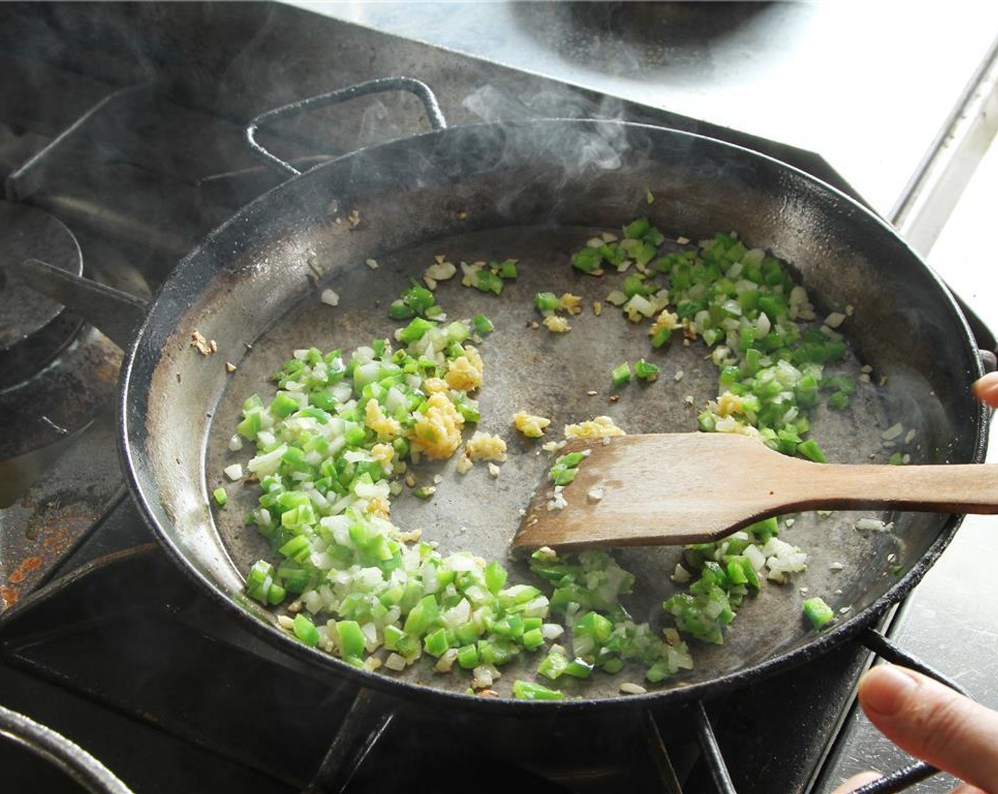 step 10 Add the minced garlic and sweat.