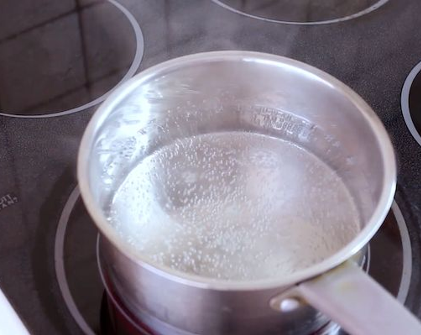 step 2 Heat up your Water (1/3 cup) in a large pot and bring to a boil.
