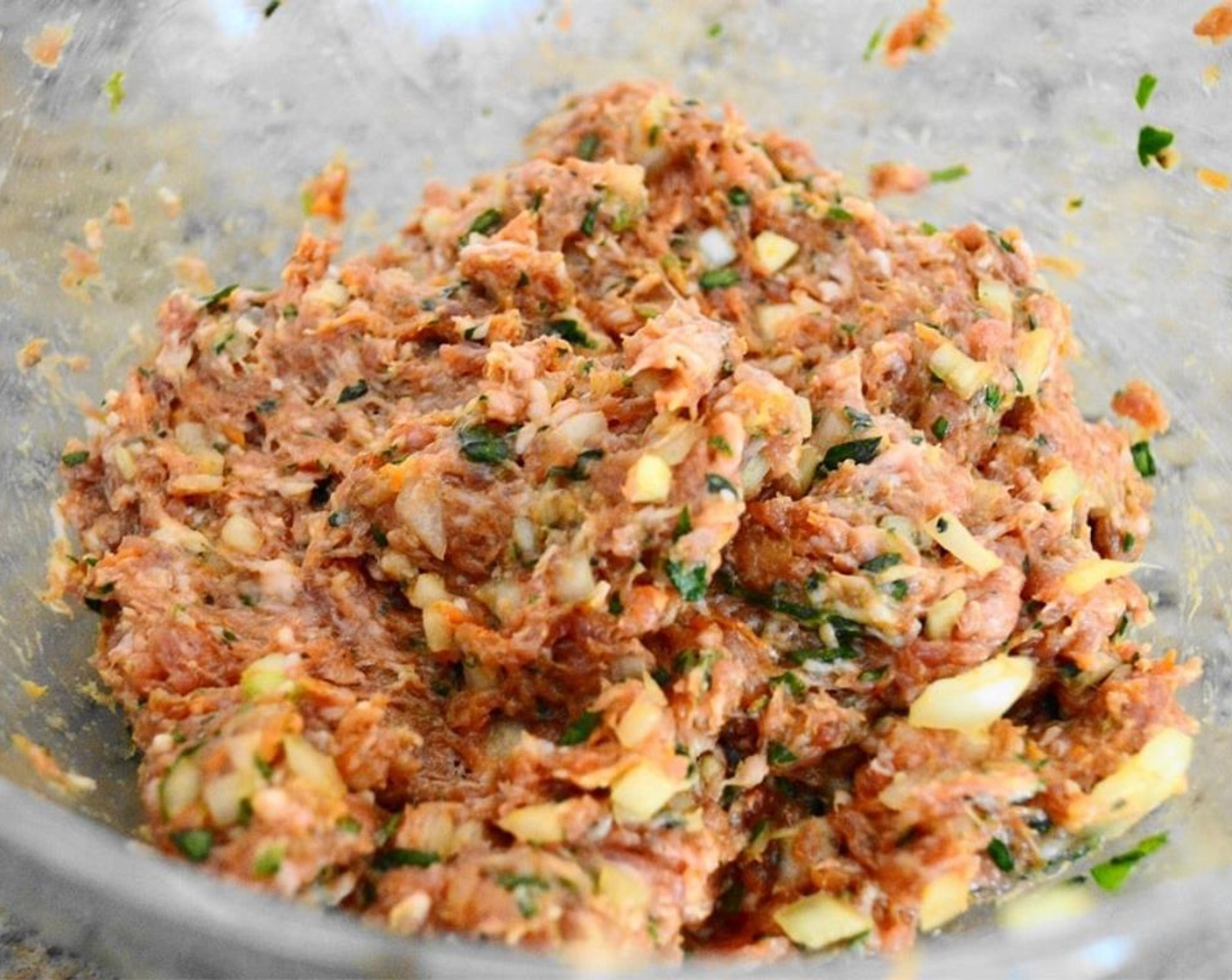 step 2 Add Salt (1 pinch), Ground Black Pepper (1 pinch), and one of the Egg (1) in a bowl. Mush it together with clean hands thoroughly like you are making meatballs or meatloaf. Set the bowl aside.