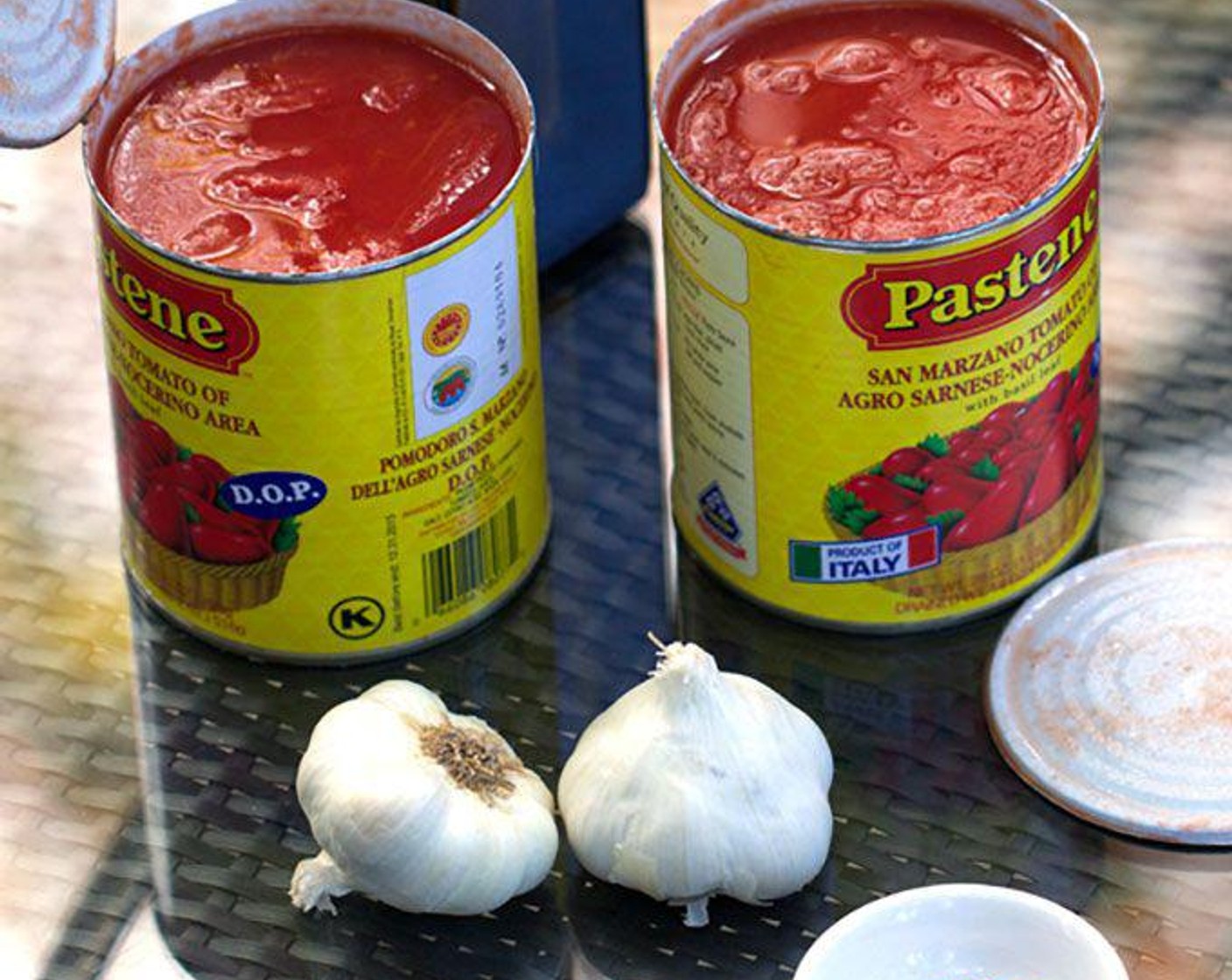 step 2 Open the cans of tomatoes and set aside.