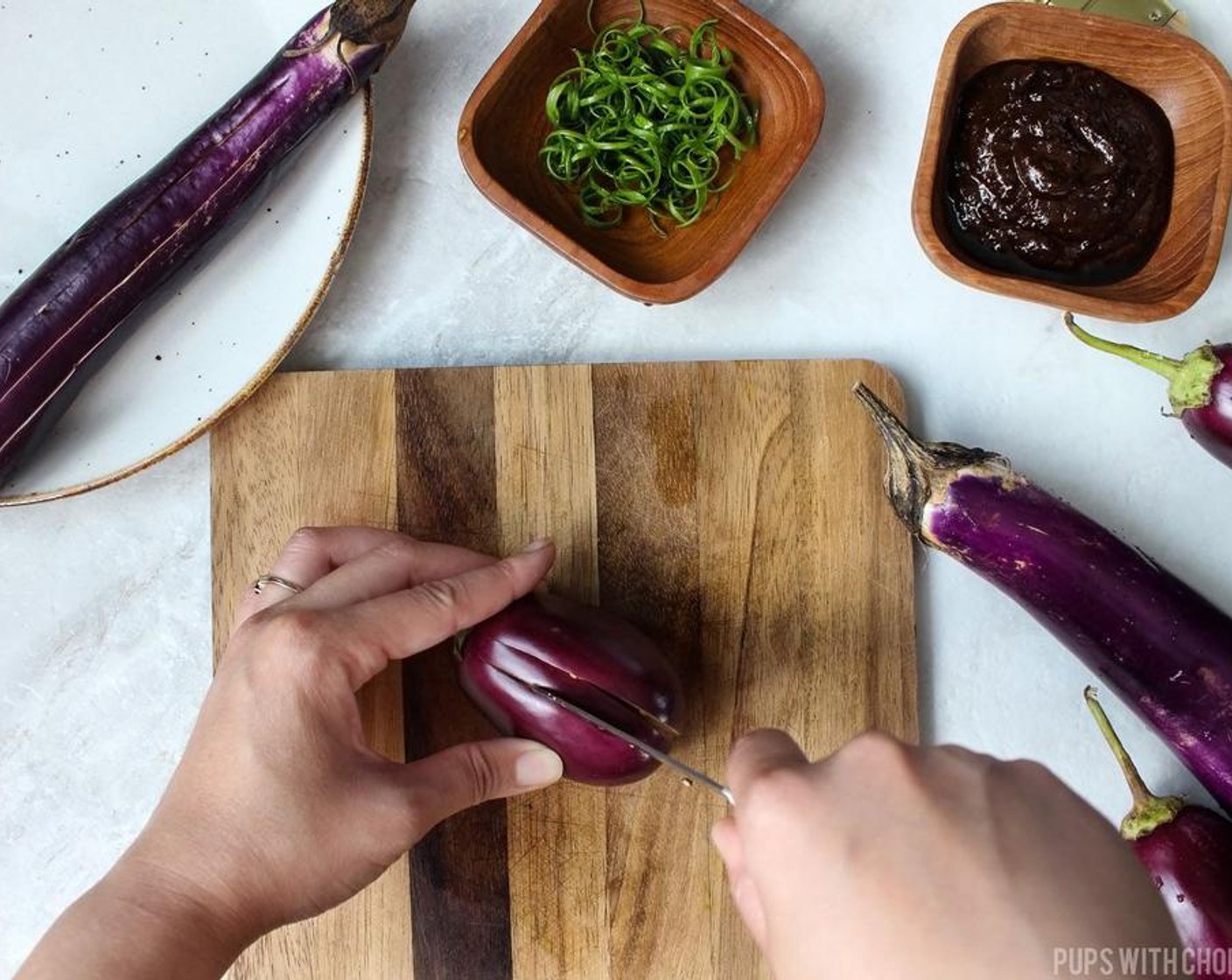 step 2 Make length wise cuts running down the Chinese Eggplant (6), 1/2 inch apart. I found it easiest to use a pairing knife or a small knife to make these cuts.