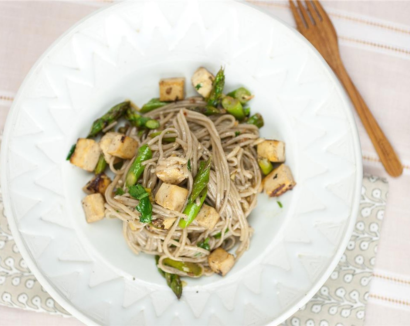 step 5 Drain and return the noodles to the pot. Add the sauce, tofu, and asparagus. Stir well to combine. Serve hot, topped with Fresh Cilantro (to taste), Crushed Red Pepper Flakes (to taste) and Sesame Seeds (to taste).