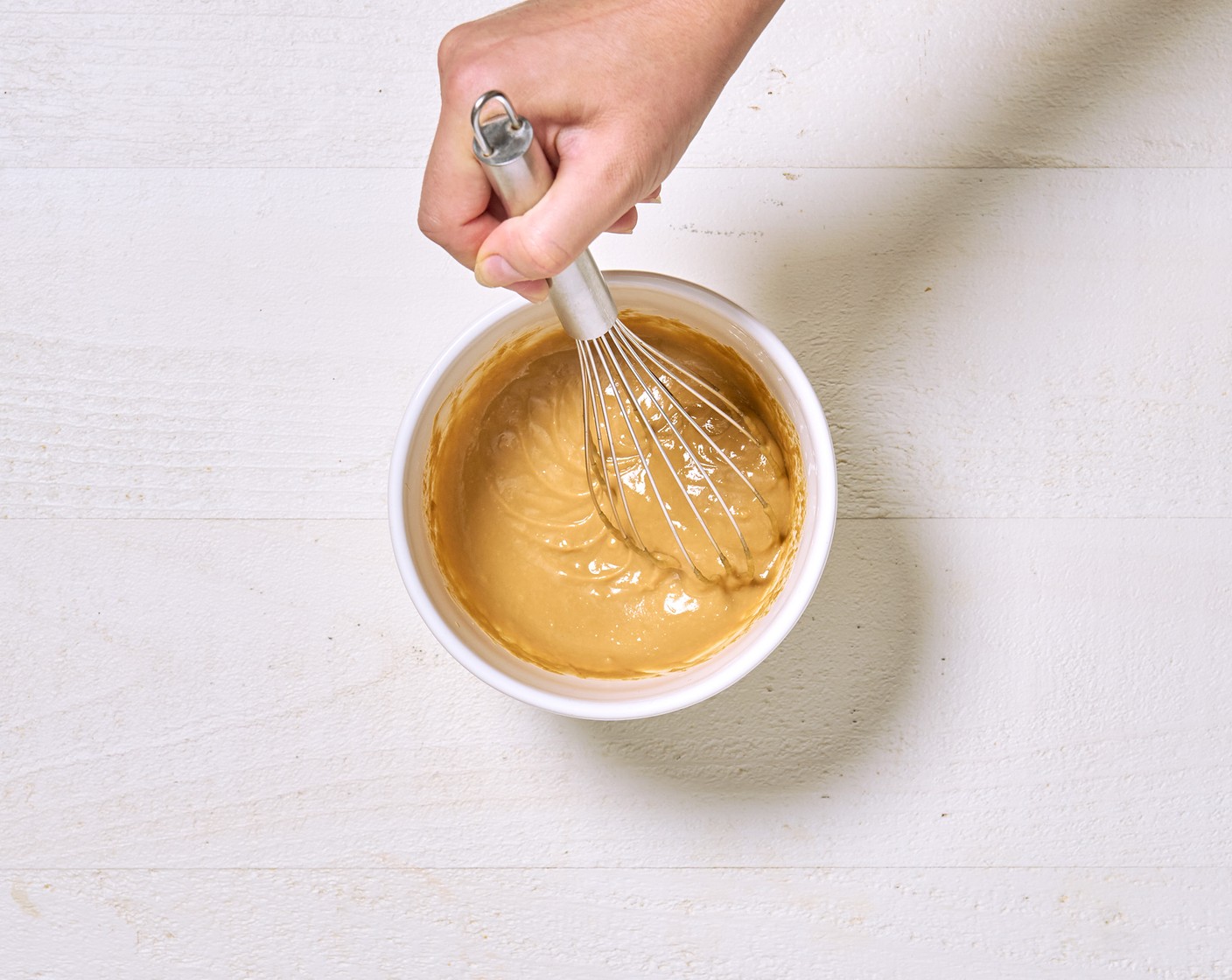 step 2 Meanwhile, make the dressing. Whisk together Toasted Sesame Oil (1 tsp), Soy Sauce (1 Tbsp), Nut Butter (1/3 cup), Seasoned Rice Vinegar (4 Tbsp), Ginger Paste (1 tsp), and Garlic Paste (1 tsp). Season with Salt (to taste).