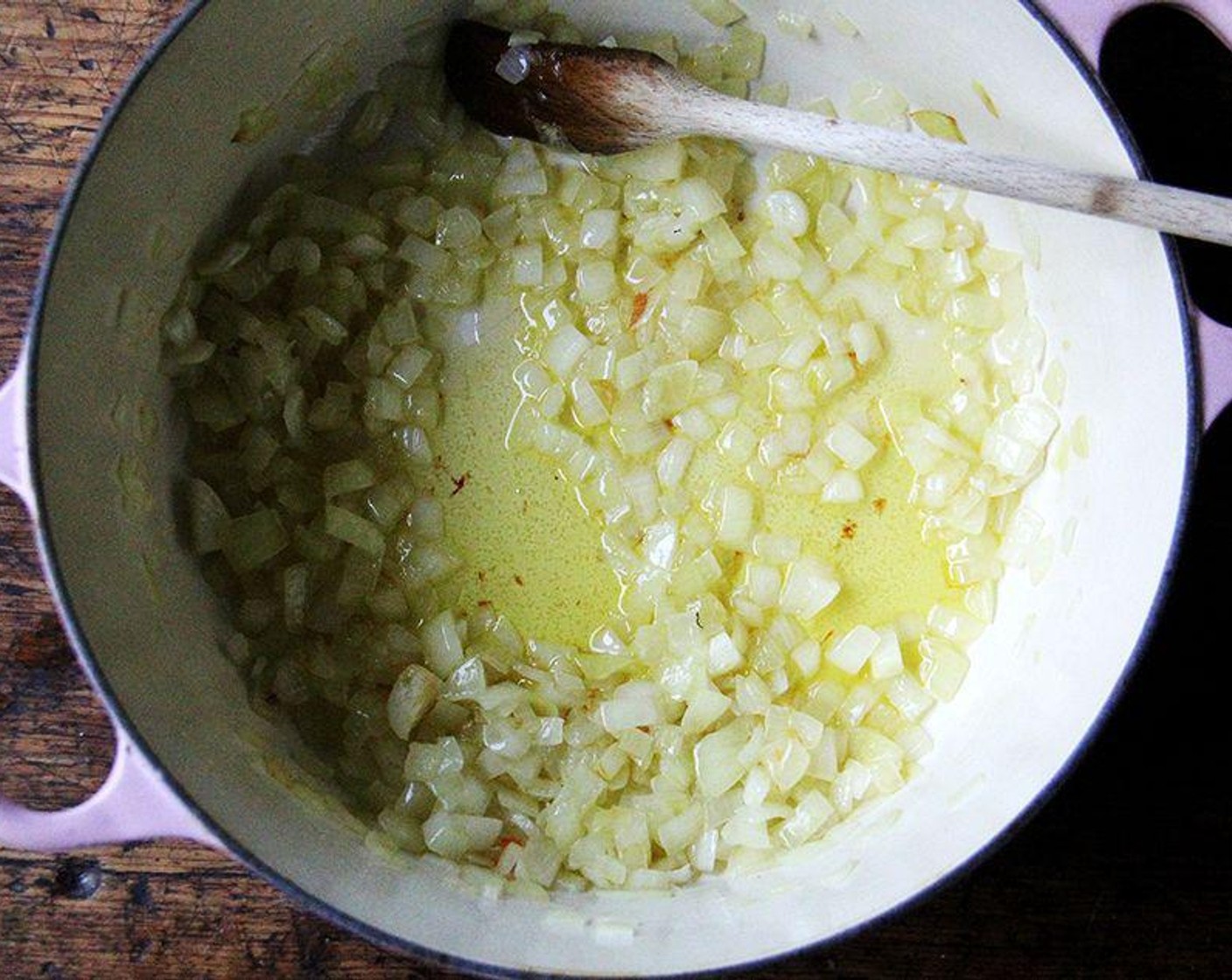 step 2 Meanwhile, in a large pot, heat the Olive Oil (1/4 cup) over high heat until it shimmers. Add the Onions (2 cups) immediately turn the heat down to medium or low, and cook, stirring, until they are soft, about 15 minutes.