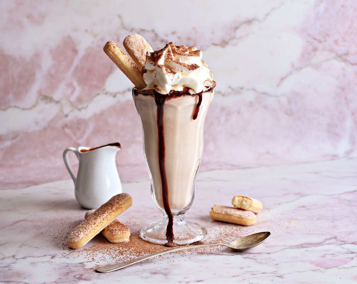 step 2 Pour into tall milkshake glasses and top with Chocolate Syrup (to taste), Whipped Cream (to taste), a dusting of Unsweetened Cocoa Powder (to taste), and Ladyfingers (to taste).