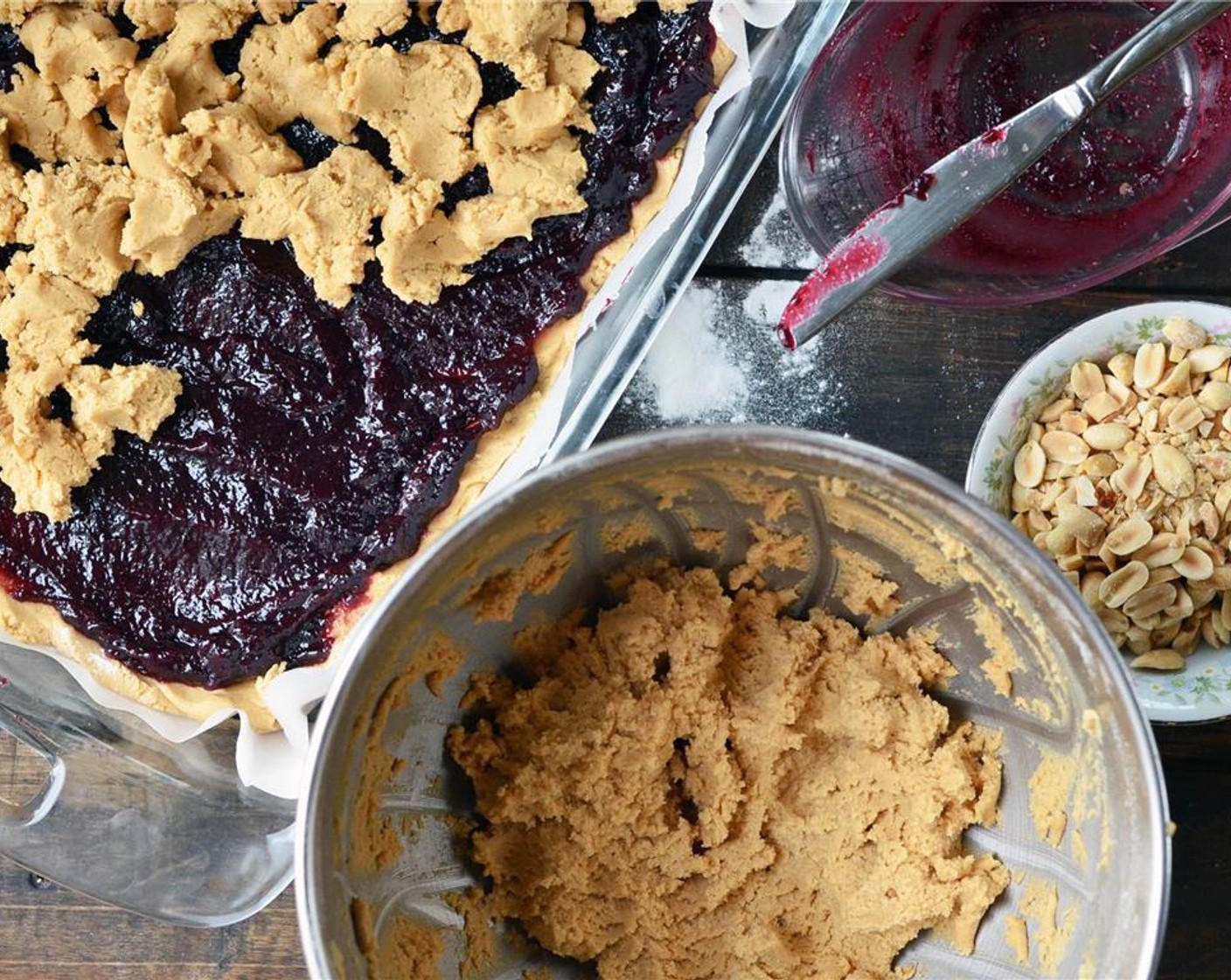 step 5 Press ½ to ⅔ of the mixture into the prepared pan. Evenly spread Grape Jelly (505 g) over crust.