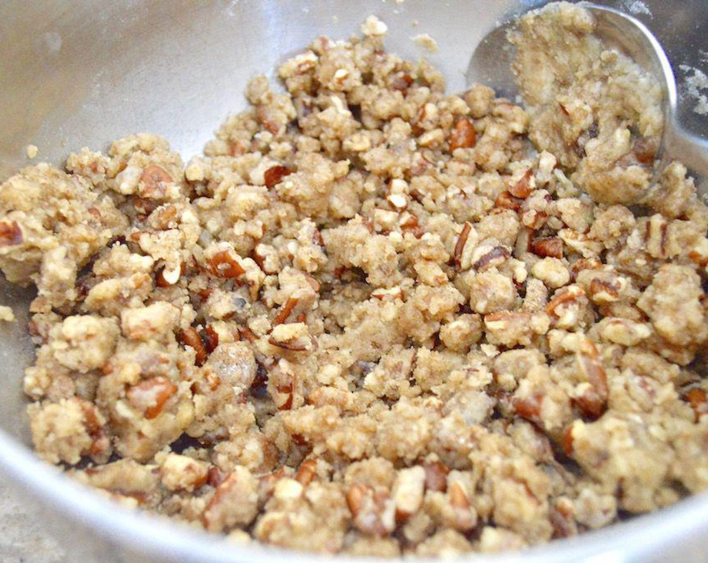 step 2 Make the crumb topping first. Simply stir the All-Purpose Flour (1/2 cup), Chopped Pecans (1/2 cup), Dark Brown Sugar (1/3 cup), Ground Cinnamon (1/2 tsp), Ground Mahlab (1/2 tsp), Ground Cardamom (1/2 tsp), Rose Water (1/2 tsp), and Butter (1/2 cup) together thoroughly until it is a moist, pebbly crumb texture.