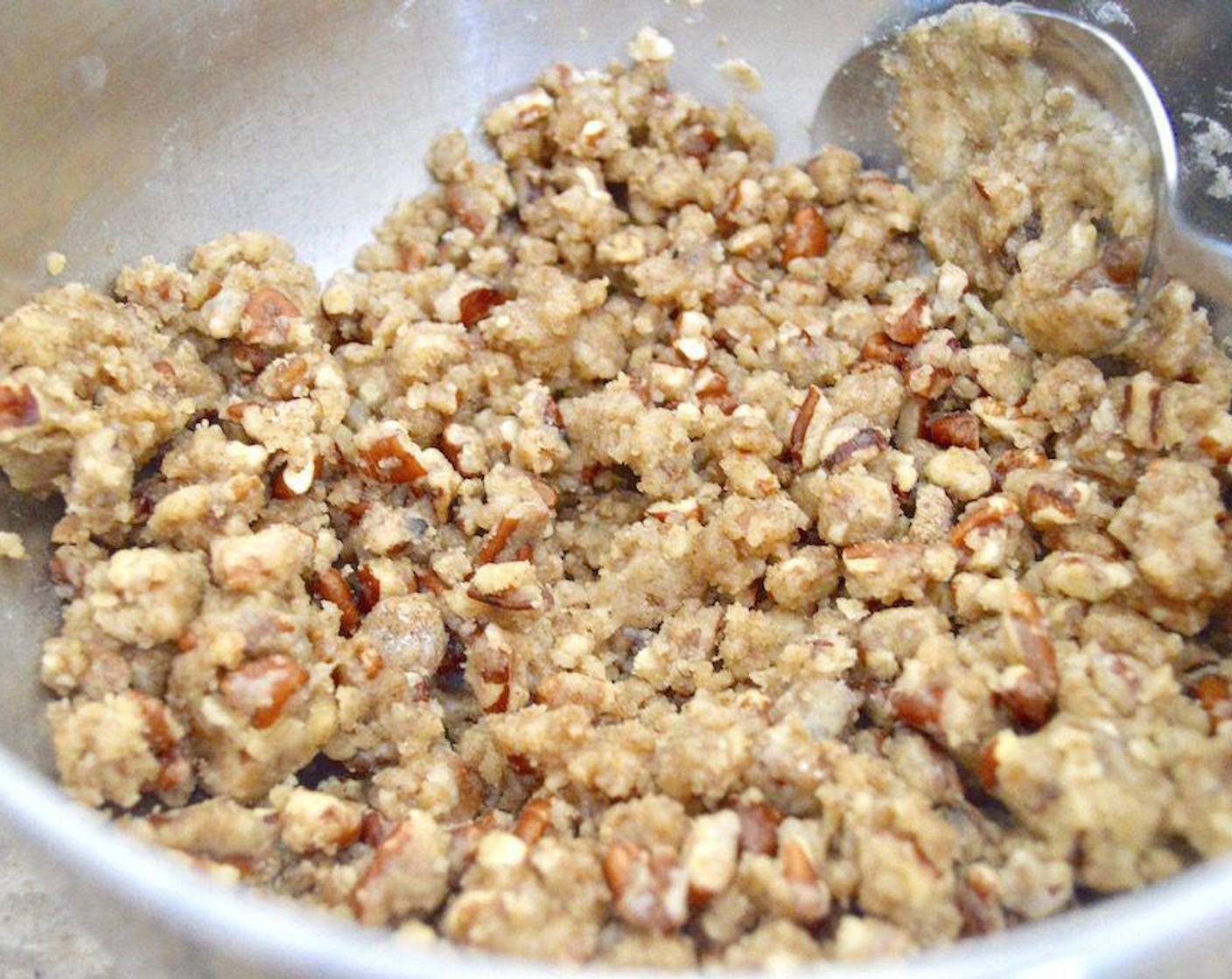 step 2 Make the crumb topping first. Simply stir the All-Purpose Flour (1/2 cup), Chopped Pecans (1/2 cup), Dark Brown Sugar (1/3 cup), Simply Organic Cinnamon, Ground (1/2 tsp), Ground Mahlab (1/2 tsp), Ground Cardamom (1/2 tsp), Rose Water (1/2 tsp), and Butter (1/2 cup) together thoroughly until it is a moist, pebbly crumb texture.