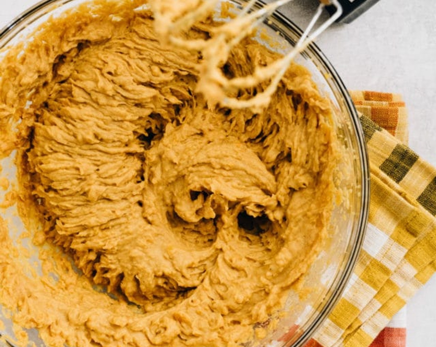step 5 Peel and discard the skins. Place the chunks of the potatoes into a large mixing bowl. Add Maple Syrup (1/3 cup), Vanilla Extract (1 tsp), Eggland's Best Classic Egg (1), Simply Organic Cinnamon, Ground (1 tsp), Ground Nutmeg (1/4 tsp), Ground Ginger (1/8 tsp), and Salt (1/4 tsp). You can mash the potatoes and stir everything together with a fork or use an electric mixer to mix until everything is combined.