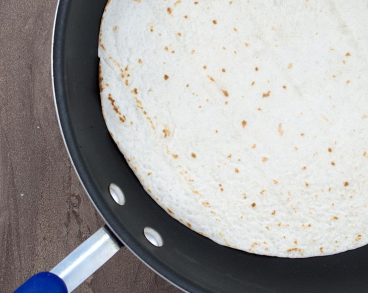 step 10 Heat Large Flour Tortillas (2) in a skillet to make the wrap easier to fold. This usually takes about a minute on each side.