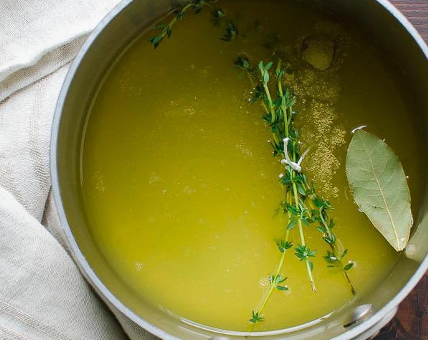 step 2 In a small saucepan, bring Vegetable Broth (1 cup), Water (1/2 cup), Bay Leaf (1/4 tsp), whole Bay Leaf (1), and Fresh Thyme (3 sprigs) to a boil. Add French Green Lentils (1/2 cup), cover and simmer about 20-25 minutes until cooked.