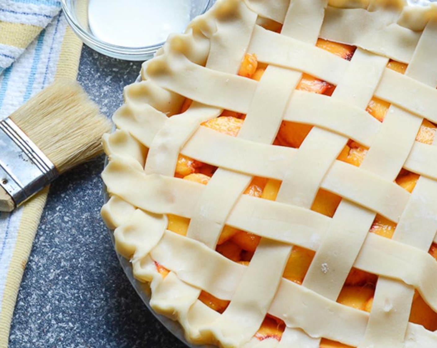 step 11 Place the pie on the baking sheet. Brush the lattice work and crust with Cream (2 Tbsp) then sprinkle the Demerara Sugar (1 Tbsp) on top.