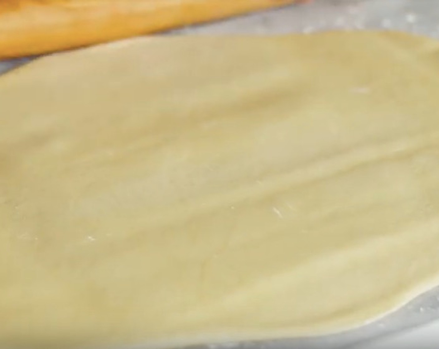 step 8 Place risen dough onto a flour surface and roll it out to a 14 or 16-inch rectangle.