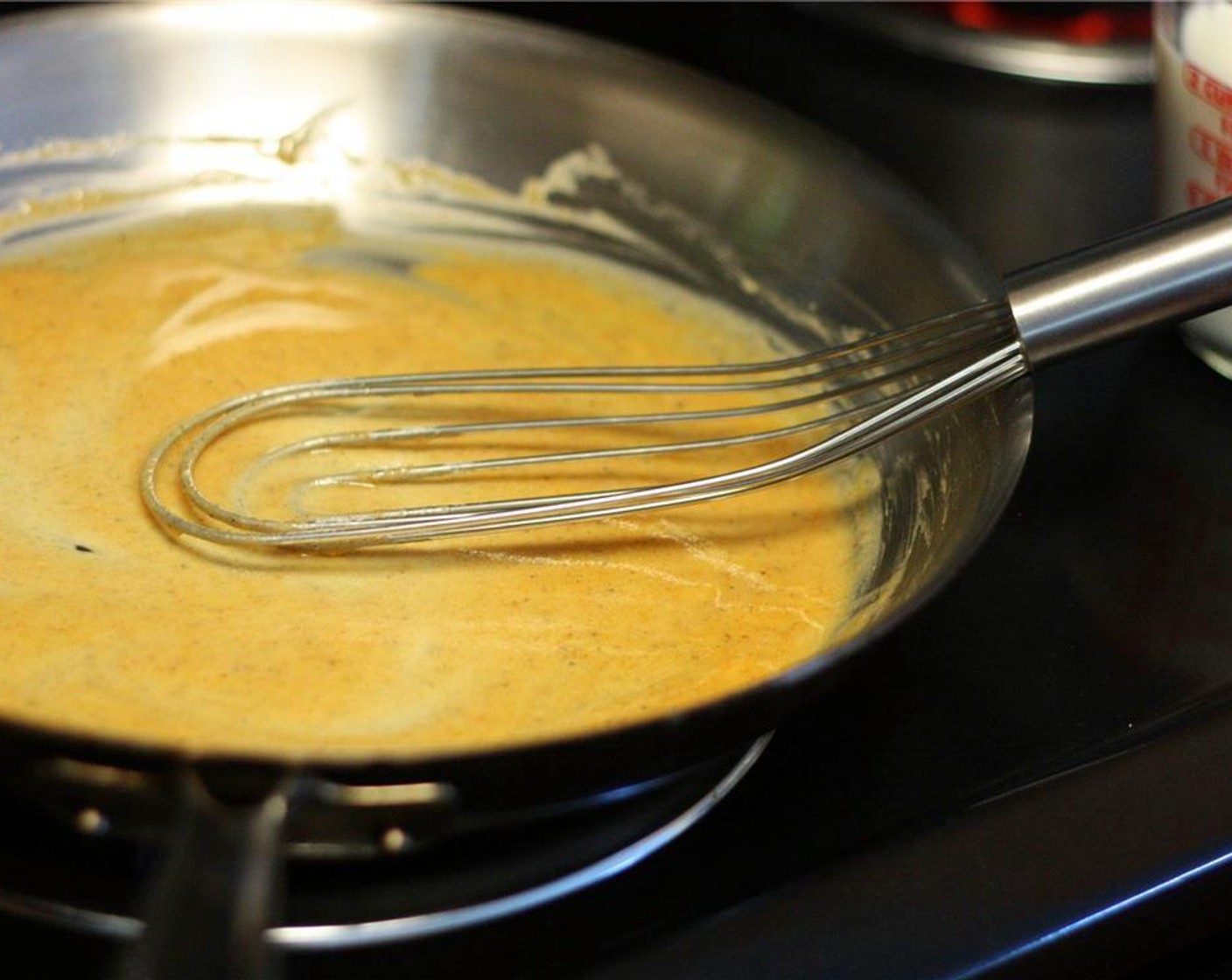 step 4 Once butter has melted, add the flour mixture to the butter. Use a roux whisk or a large fork to mix, whisking constantly. The mixture will begin to smooth out. Once it has cooked for about 3 minutes, slowly add the milk.