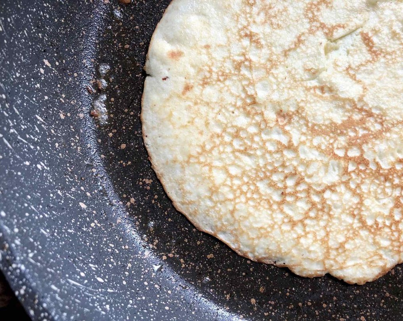 step 3 Fully cook until golden on one side, then flip and cook 30 seconds more.  Remove to a plate and continue with the remaining batter to make a total of 8 crepes.