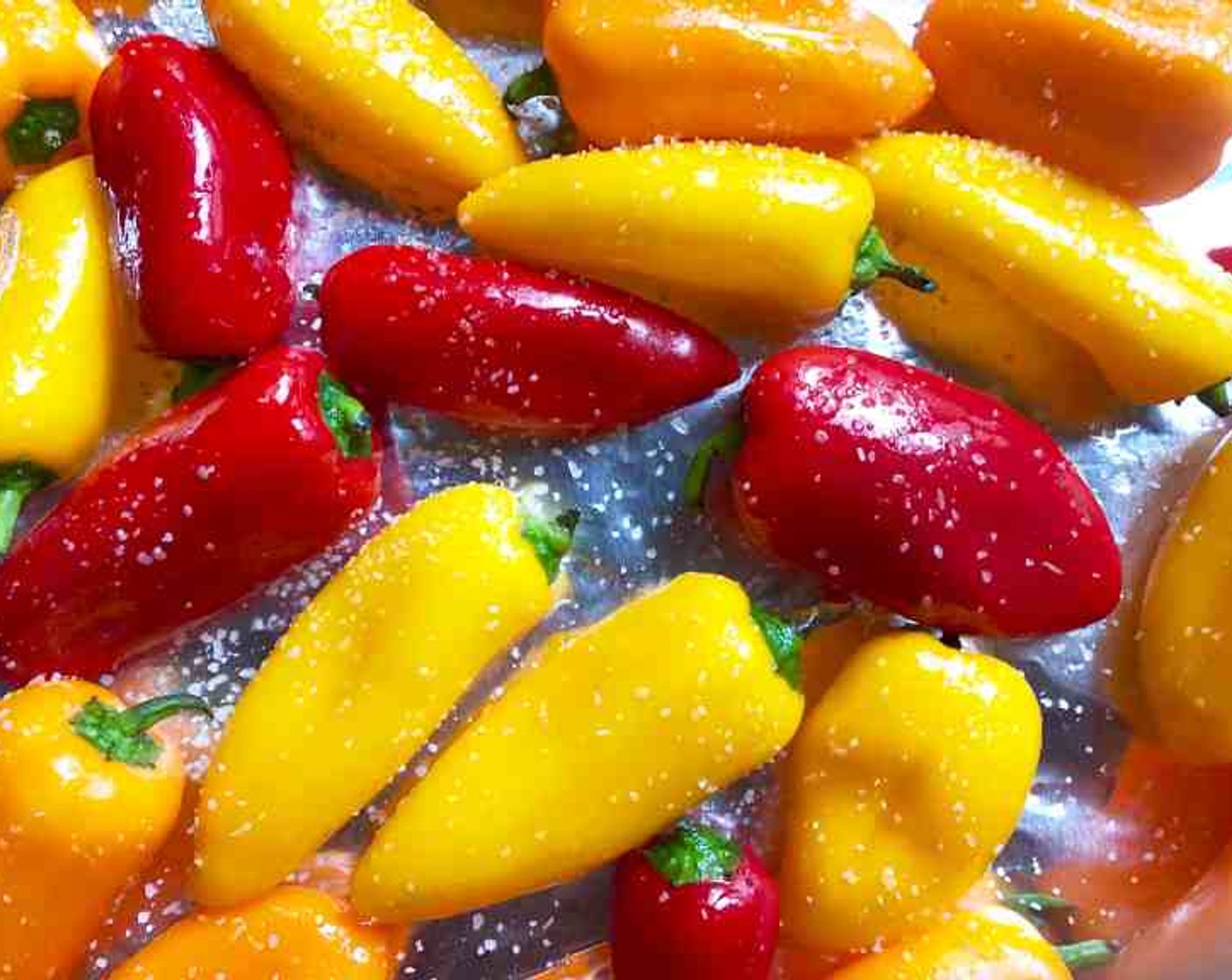 step 1 Preheat the broiler on high with the oven rack about 5-inches from heat. Toss the Mini Peppers (2 pckg) with Olive Oil (1 Tbsp) and Kosher Salt (1/2 tsp), arrange them in a single layer on an aluminum foil-lined rimmed baking sheet.