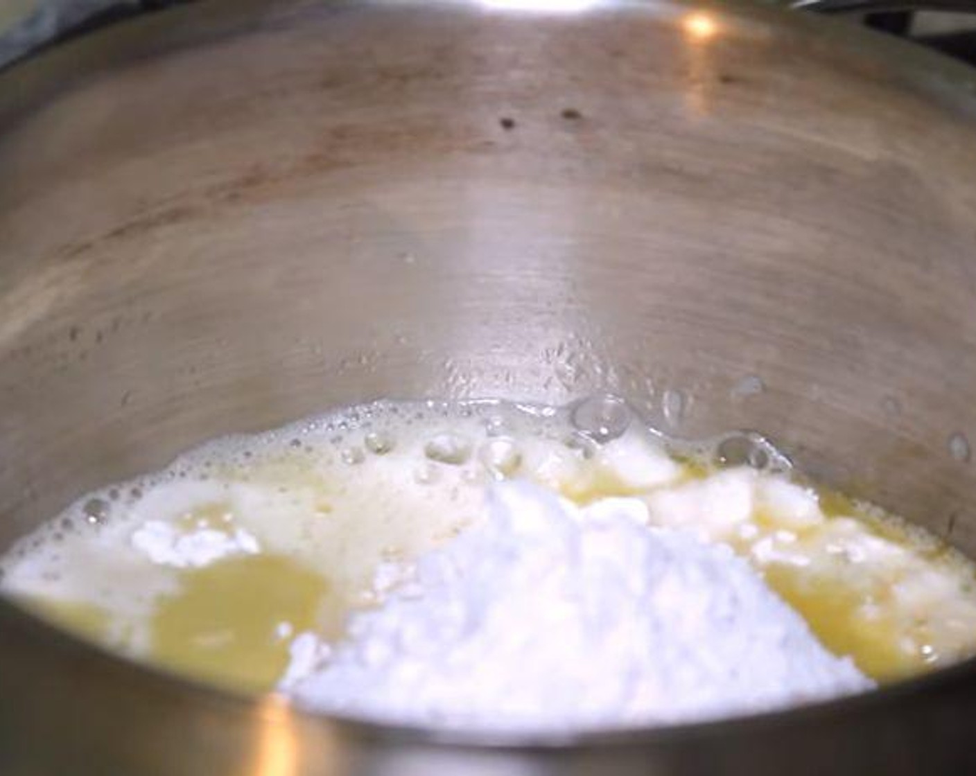 step 1 Put a saucepan over medium heat. Add the Water (1 cup), Butter (2 Tbsp), Salt (1/2 tsp), and Granulated Sugar (1 Tbsp). Let the water come to a boil. Add the All-Purpose Flour (1 cup) and turn the heat to low. Whisk everything together.