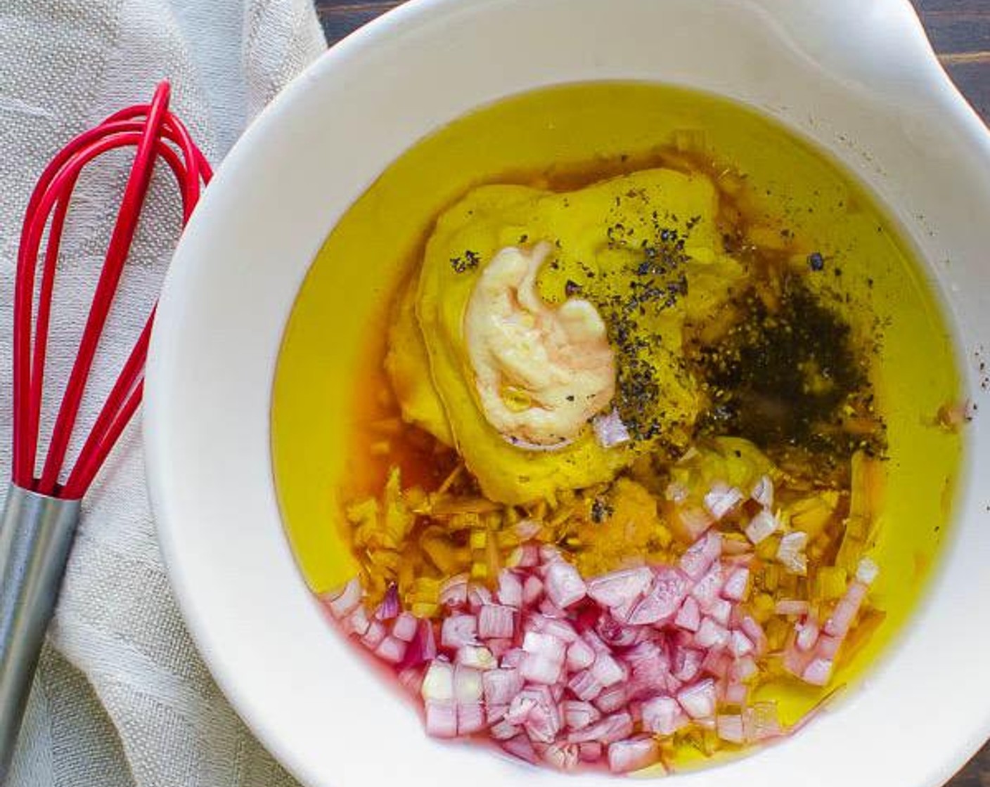 step 5 In a small bowl, whisk together diced shallots, Red Wine Vinegar (2 Tbsp), Dijon Mustard (2 tsp), Extra-Virgin Olive Oil (1/3 cup), Kosher Salt (1/2 tsp), and Freshly Ground Black Pepper (1/4 tsp) until the mixture is emulsified.