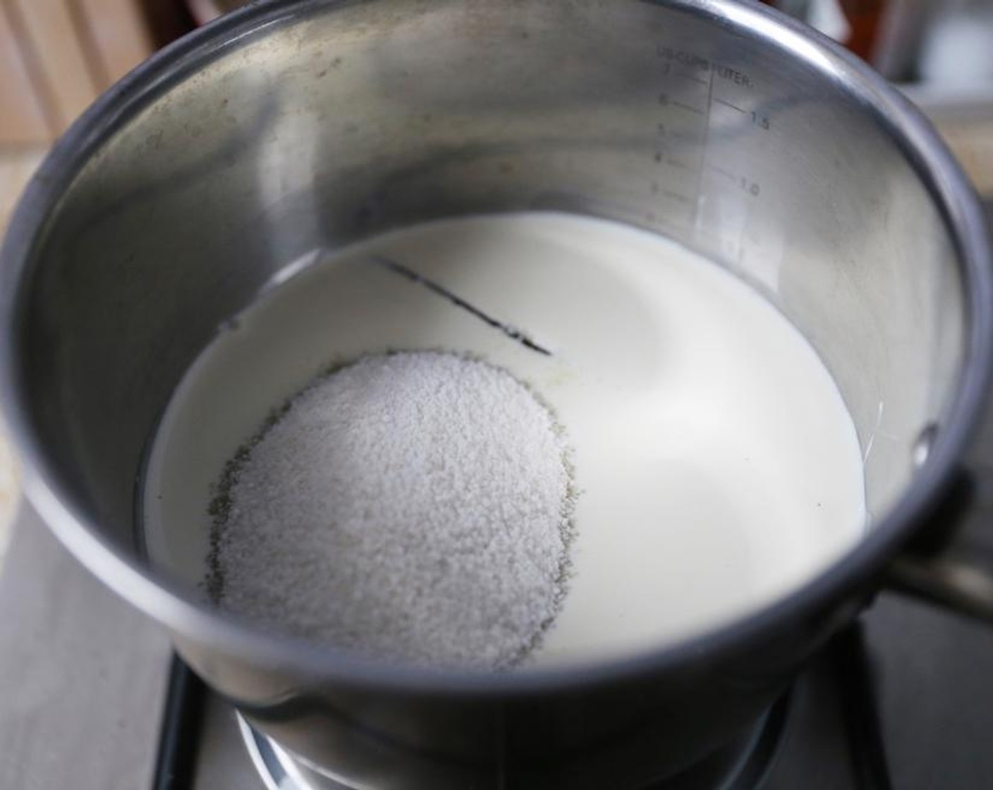 step 2 Combine the Cream (1 cup), Caster Sugar (1 cup) and Vanilla Bean Pod (1) in a medium saucepan over medium heat and stir to dissolve the sugar.