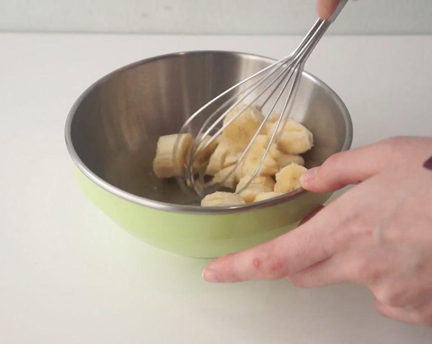 step 2 Slice up the Bananas (2) and mash them up in a separate bowl. For a fluffy pancake, leave some chunks when mashing the bananas.