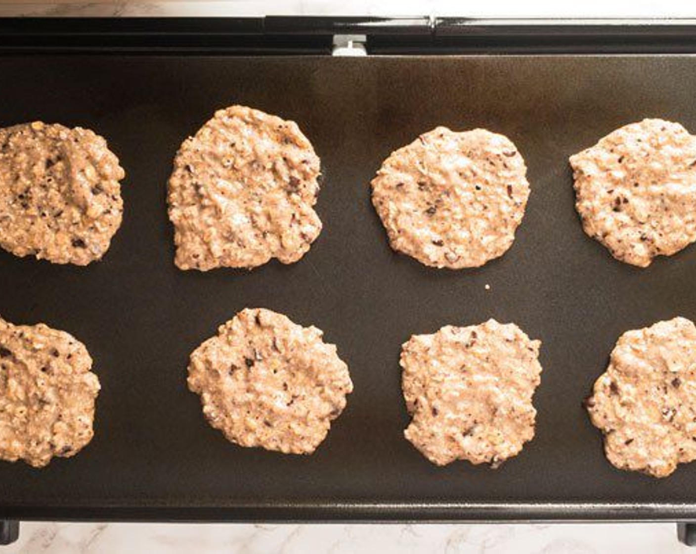 step 7 Heat griddle to 350 degrees F (180 degrees C) or turn stove top to med-hi. Spray griddle/pan. Pour about 1/4 cup mix for each pancake. Makes a dozen 3" pancakes.