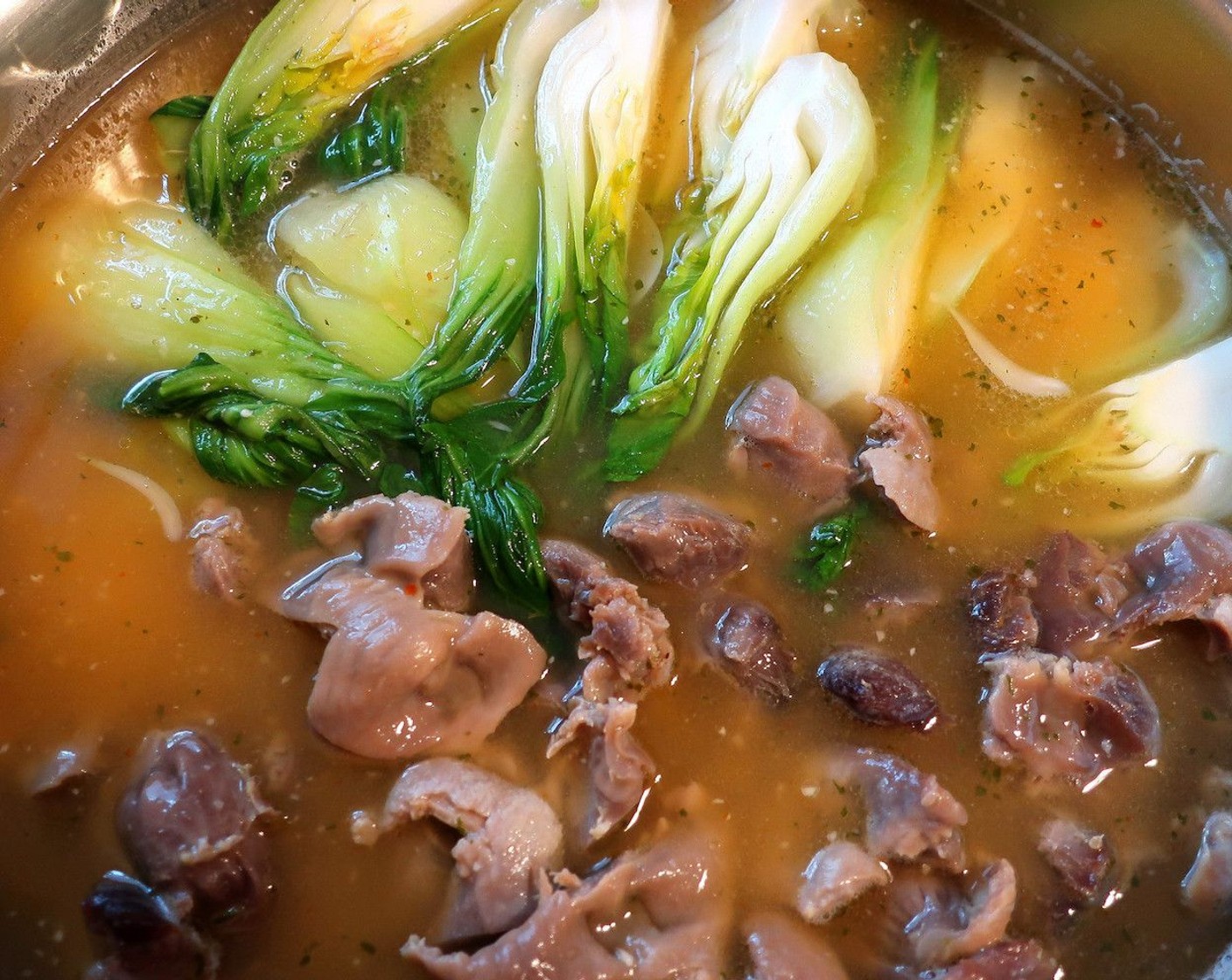 step 7 Add the boc choy to the soup, bring to a simmer, remove from heat at once, check/adjust seasoning.