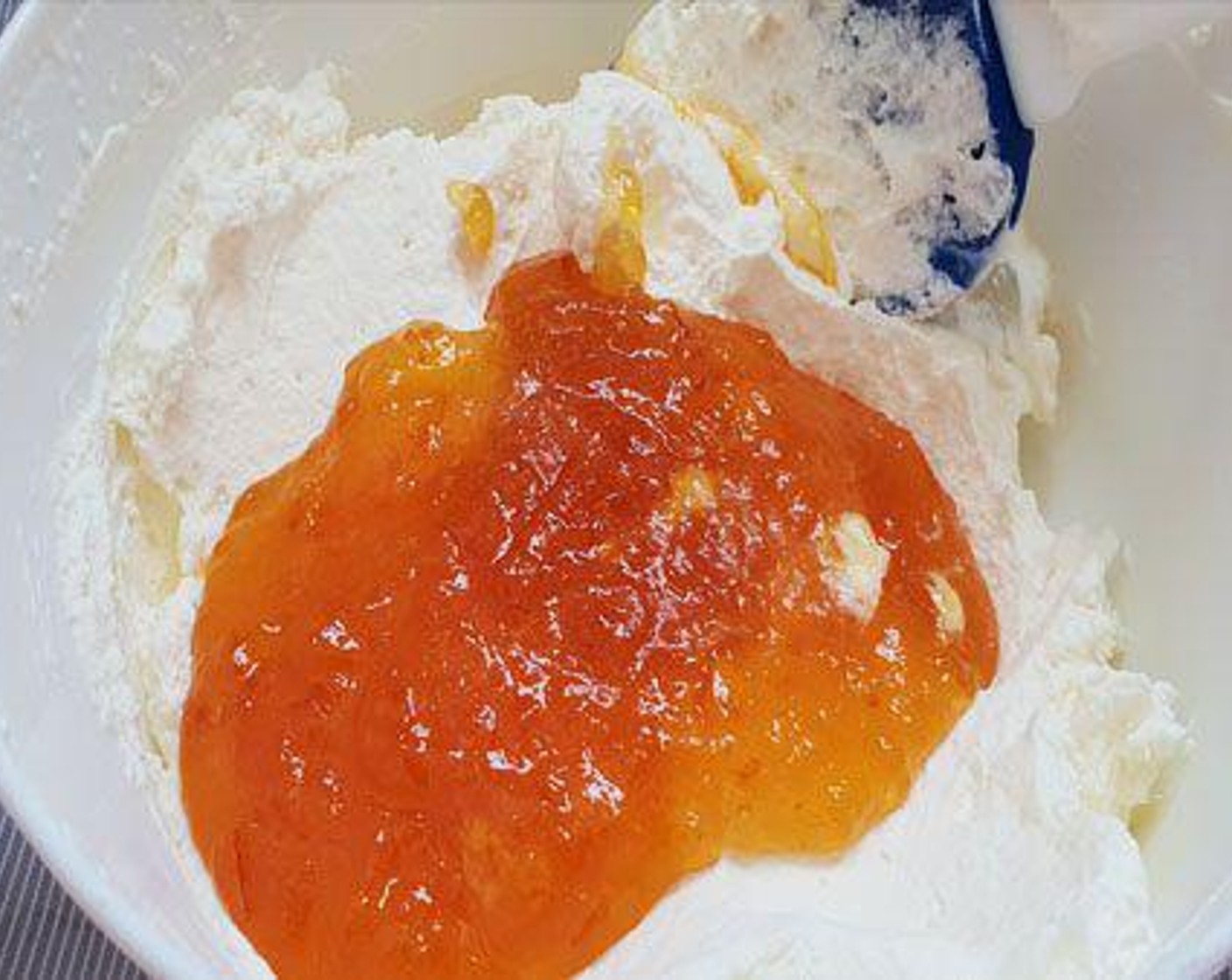 step 5 For filling: Beat the Whipping Cream (1/2 cup) until stiff. Add Orange Marmalade (1/2 cup) and Orange (1/2 tsp) and combine.
