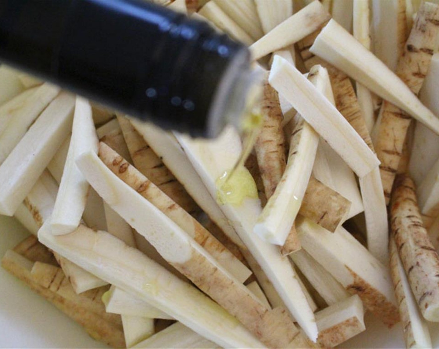 step 2 Toss Parsnips (8) with 2 tablespoons of olive oil, Salt (to taste), and Ground Black Pepper (to taste).