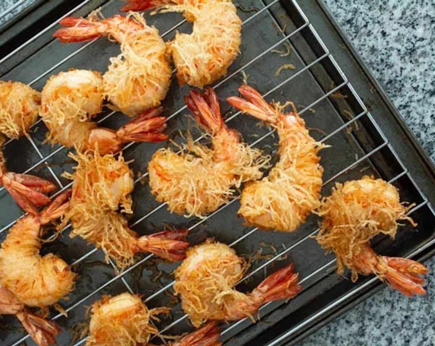 step 6 Place the fried shrimp on paper towels or on a cooling rack over a cookie sheet.