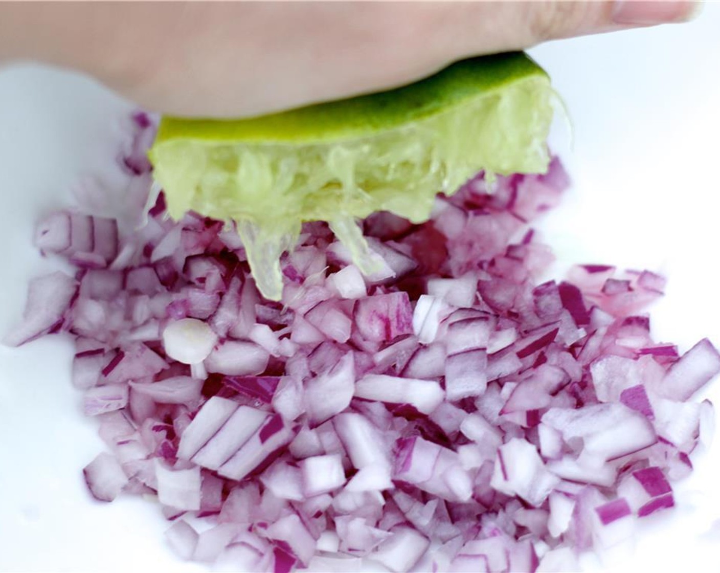 step 2 Roll the limes across your cutting board to activate the juices. Halve the Limes (2), and squeeze the juice directly into the bowl.