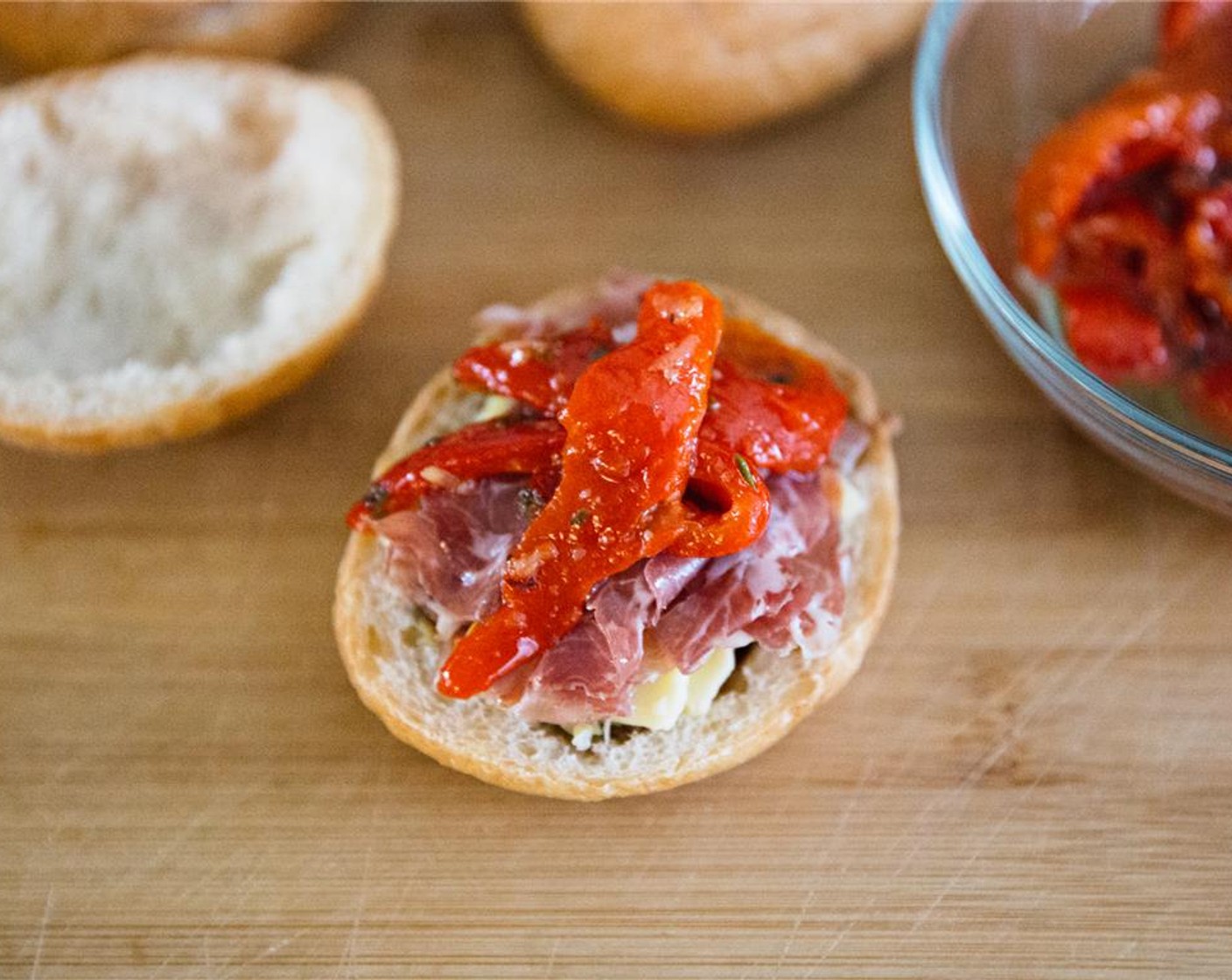 step 9 Place a few strips of Jarred Roasted Red Peppers (1/4 cup) on top of the coppa.