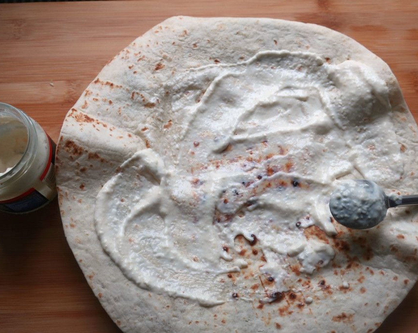 step 3 Spread Creamy Horseradish Sauce (to taste) on the tortilla.