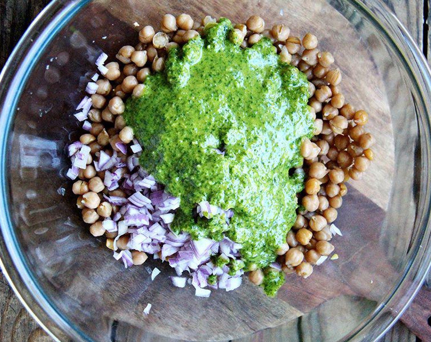 step 3 Place GOYA® Chick Peas (2 1/4 cups) in a large bowl. Add Red Onion (1). Toss with dressing to taste.
