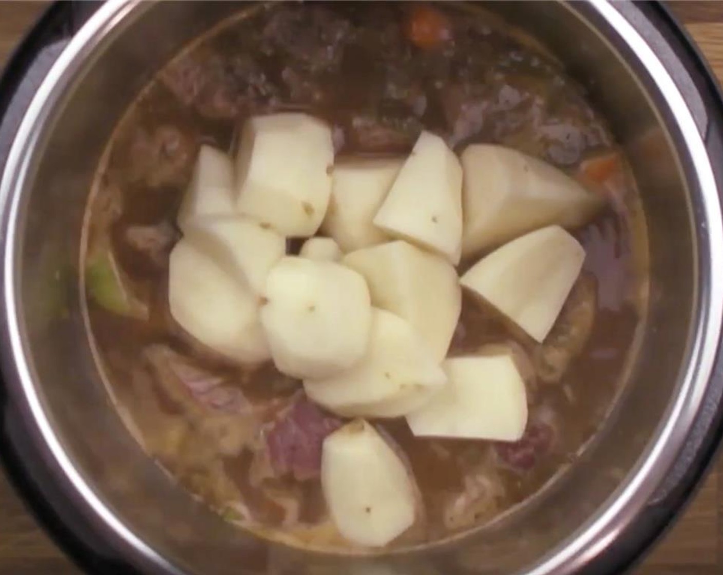 step 12 Lastly, add the cubed Russet Potatoes (3) on top. Then, close the lid.