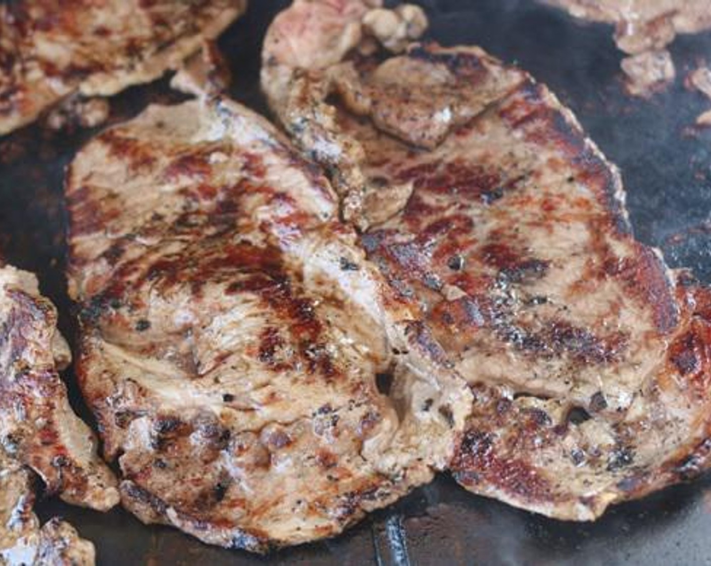 step 5 Place the Boneless Ribeye Steak (1.5 lb) on the griddle and season with the same All-Purpose Spice Rub (1/4 cup). Work in batches here to avoid overcrowding the grill. Each side needs to cook for 2-3 minutes then use a spatula and knife to cut the meat into strips